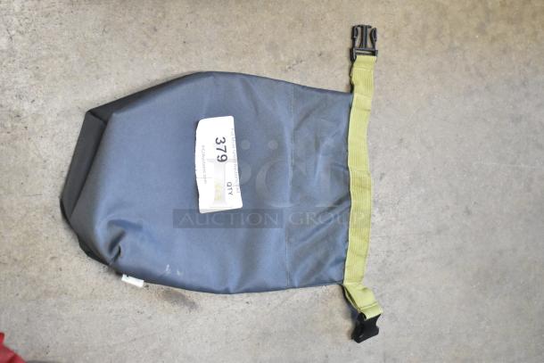 Gray and olive bag with contents, item 379, labeled "3X" on auction tag.