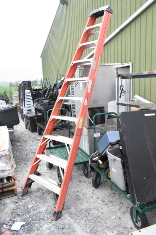 Werner 10' A-frame ladder, fiberglass, orange, good condition, safety labels visible. Ideal for construction or home use.
