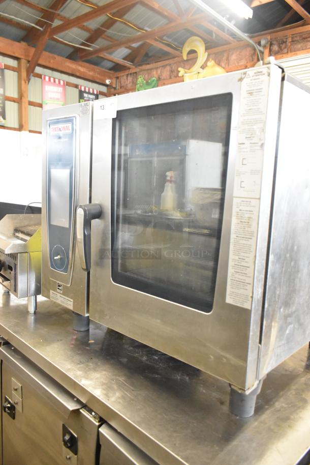 2018 Rational SCC WE 61G stainless steel commercial countertop combi convection oven, natural gas, with clear display panel.
