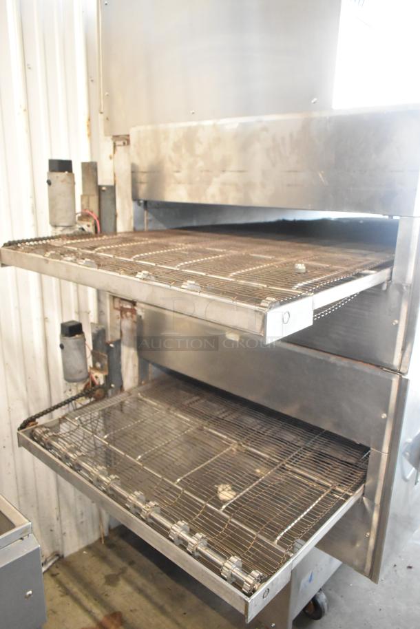 Middleby Marshall PS360 stainless steel natural gas conveyor pizza oven, commercial casters, 135,000 BTU, used condition.