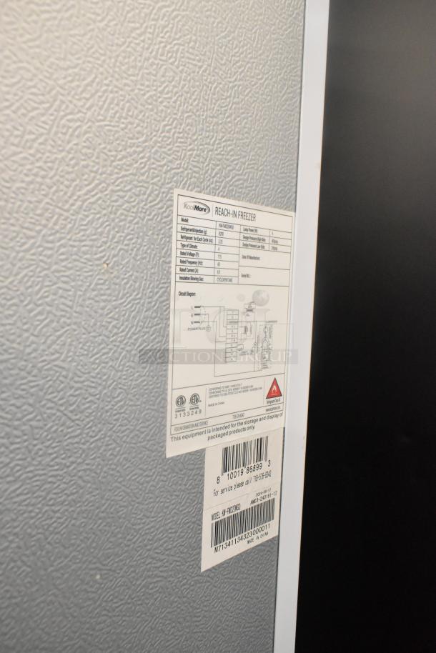 KoolMore KM-FMD20WG0 reach-in cooler merchandiser label, showing model and specifications. Note: cooler not functioning properly.