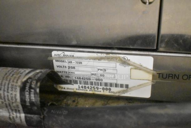 Alto Shaam AR-7EVH electric rotisserie oven label showing model, 208 volts, 3-phase, and serial number details.