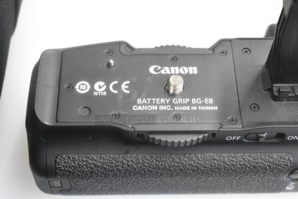 Hard black case with Canon DS126371 camera body, Canon Battery Grip BG-E8, wires, in well-maintained condition.