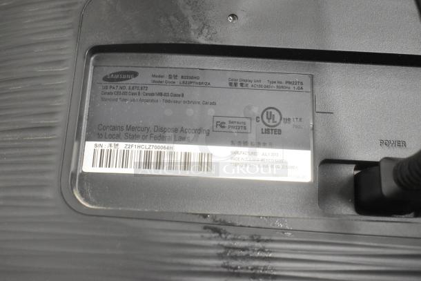 Samsung LS22PINSF/ZA TV label showing model number, manufacturing details, and safety marks. Made July 2010.