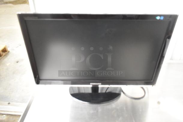 Samsung P2450 monitor in original box, tested and working. Features a sleek design and glossy finish, perfect condition.