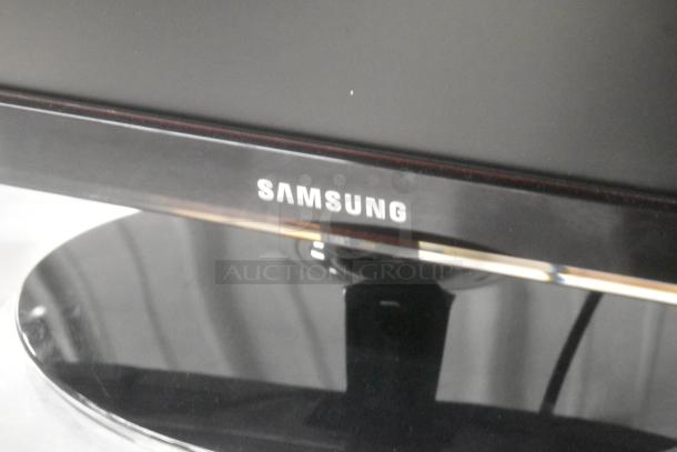 Samsung P2450 monitor in original box, tested and working. Features glossy black frame, visible Samsung logo.