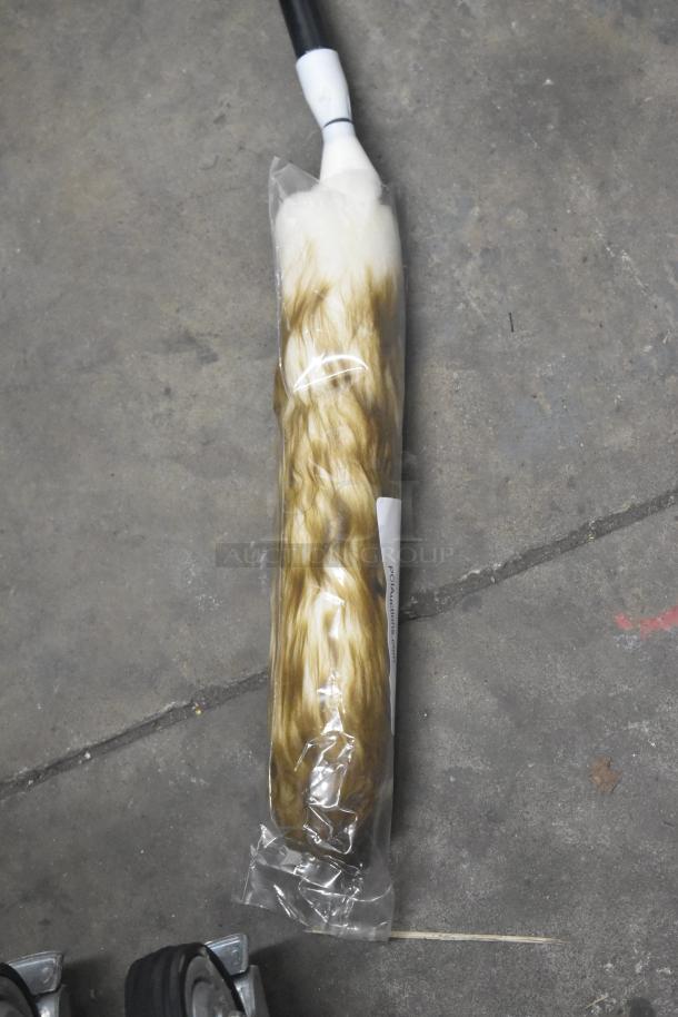 Brand new telescopic wool duster in packaging, featuring a white handle and soft wool head for efficient dusting.