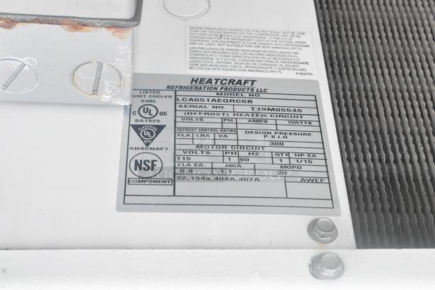 Label on Heatcraft LCA651AEQRC6B evaporator shows model, serial number T19M05545, and specifications for a walk-in freezer.