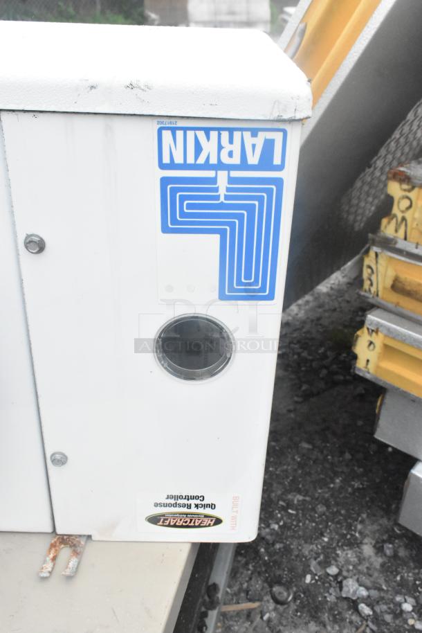 8'x10' Thermalrite Walk In Freezer; visible Heatcraft label, Larkin sticker, white exterior, used condition.