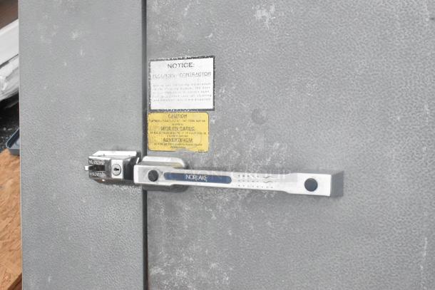 6'x8' Norlake walk-in freezer with Norlake CPF100DC condenser and Copeland compressor. Includes caution labels.