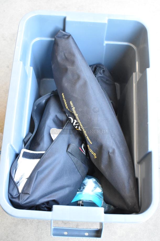 Poly bin with various items including Impact Aputure gear. Black cases and equipment visible. Good condition.
