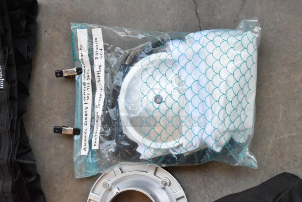 Lot with Impact Aputure items in poly bin, includes Phottix Raja parabolic softbox and diffusion grid. Visible label info.