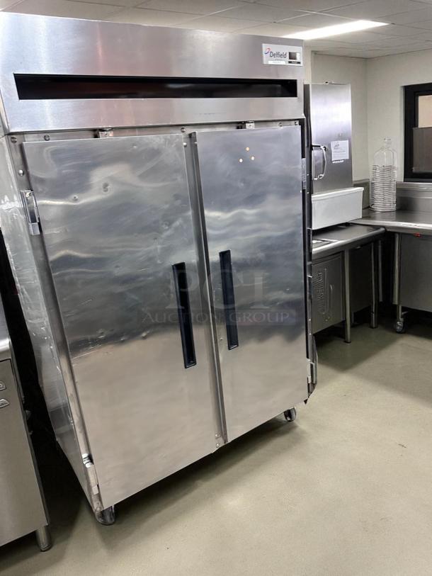 Delfield 6151XL-S two-door reach-in refrigerator in excellent condition, 115V, fully tested and working, silver finish.
