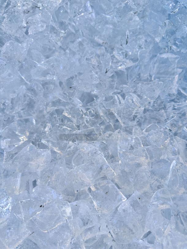 Clear crescent-shaped ice cubes from Hoshizaki KM-500MAH ice maker, excellent condition, fully tested.