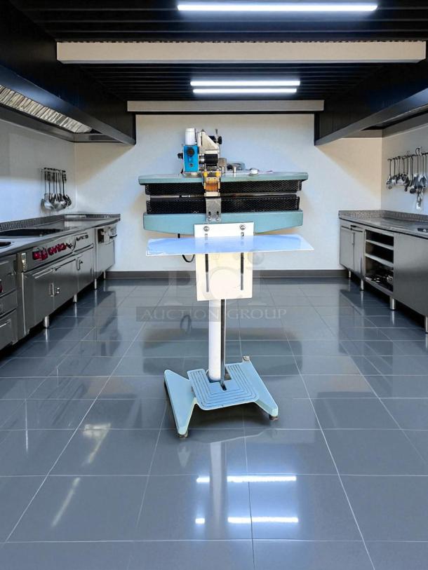 AIE ME-400CFN constant heat sealer, excellent condition, fully tested, 420W, 115V, shown on stand in kitchen setting.