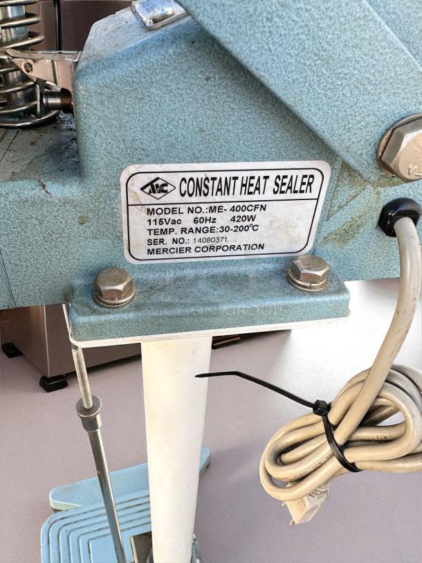 AIE ME-400CFN constant heat sealer, 420W, 115V, excellent condition. Temp range: 30-200°C. Fully tested, Mercier Corp. tag visible.