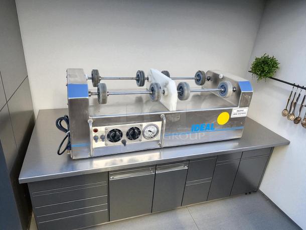 Ideal IU2X25S Roller Bottle Mixing Machine, excellent condition, 115V, fully tested, multiple knobs, and visible model label.