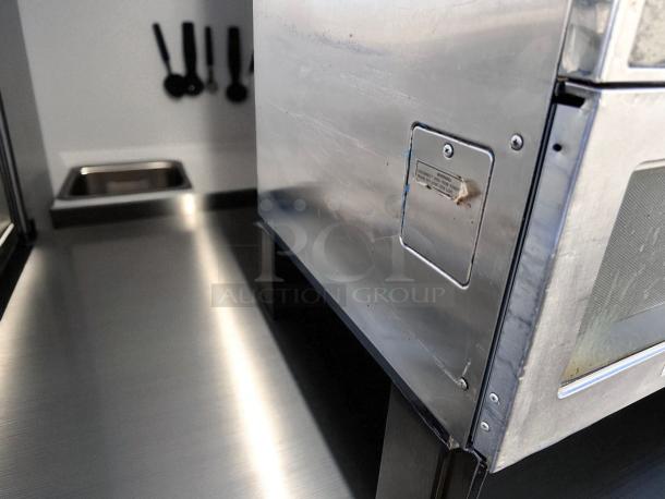 Panasonic commercial microwave, heavy-duty stainless steel, excellent condition, fully tested, visible warning label.