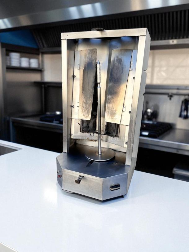 Alt text: Autodoner 3PG vertical broiler shawarma machine, natural gas, stainless steel, excellent condition, fully tested.