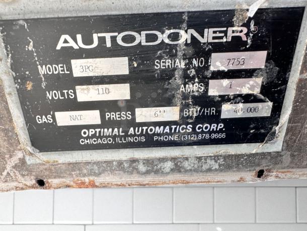 Alt text: Label on Autodoner 3PG shawarma machine showing model, serial number 7753, volts 110, natural gas, 40,000 BTU/hr.