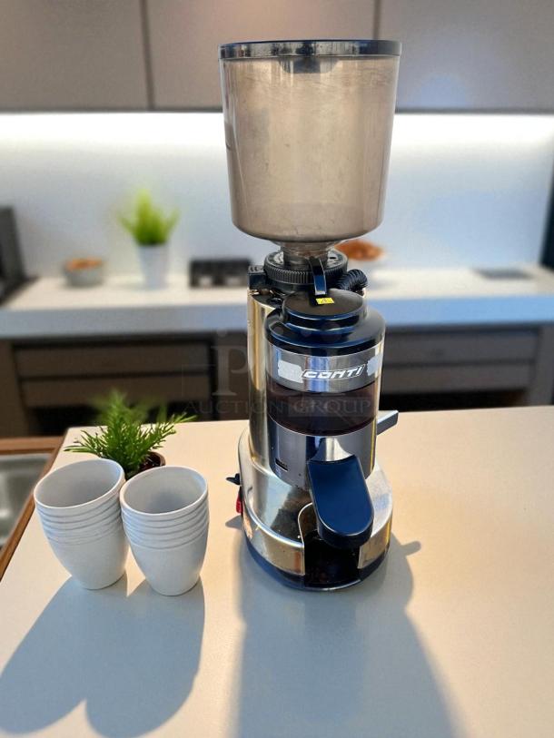 Conti RR45 commercial coffee grinder in excellent condition, 110V, fully tested and working, shown on a kitchen counter.