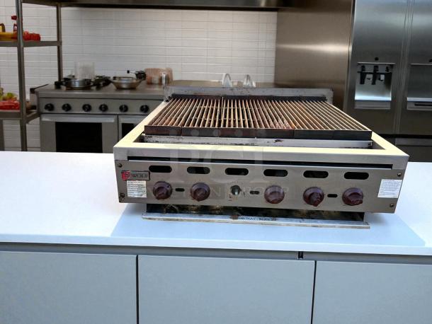 Wolf ACB36-101 36" gas charbroiler, natural gas, outstanding condition, fully tested and working, visible control knobs, branding.