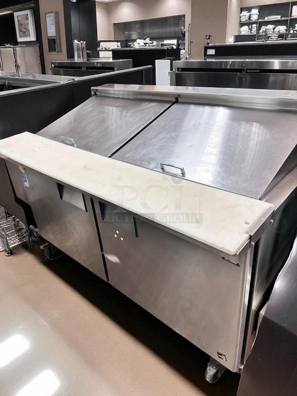 True TSSU-60-16 refrigerated prep table, excellent condition, 60" width, stainless steel, dual lids, tested and working.