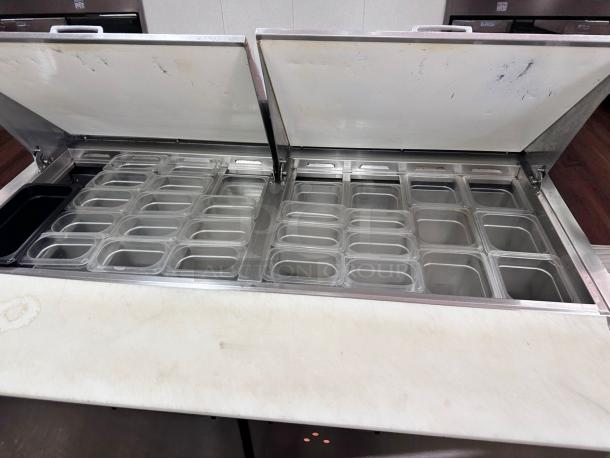 True TSSU-60-16 refrigerated prep table in excellent condition, featuring multiple compartments, 60-inch width, fully tested.
