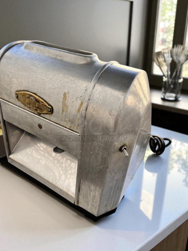 Landers Model 500 steak tenderizer machine in excellent condition. Metallic finish with a visible Landers brand logo. Fully tested.