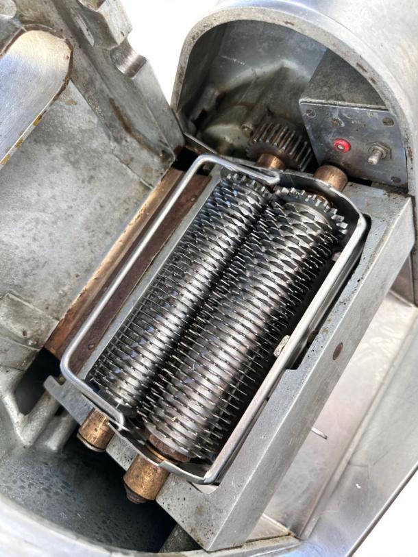 Landers Model 500 steak tenderizer machine in excellent condition, fully tested, with visible rollers and gear mechanism.