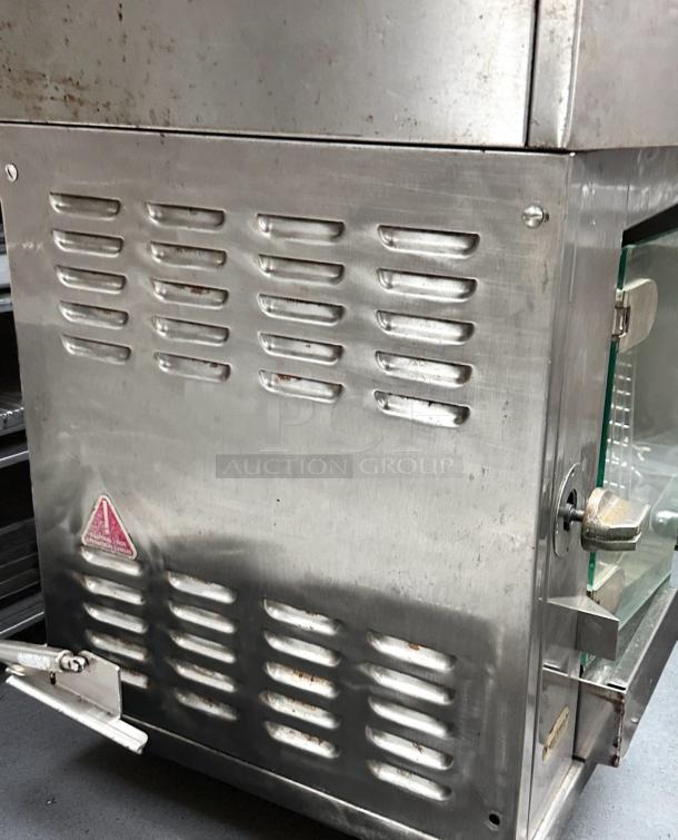 Rotisol 950-2 gas rotisserie oven, natural gas, excellent condition, fully tested, stainless steel exterior with ventilation.
