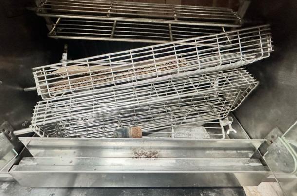 Rotisol 950-2 gas rotisserie oven in excellent condition, featuring stainless steel racks. Natural gas, fully tested.