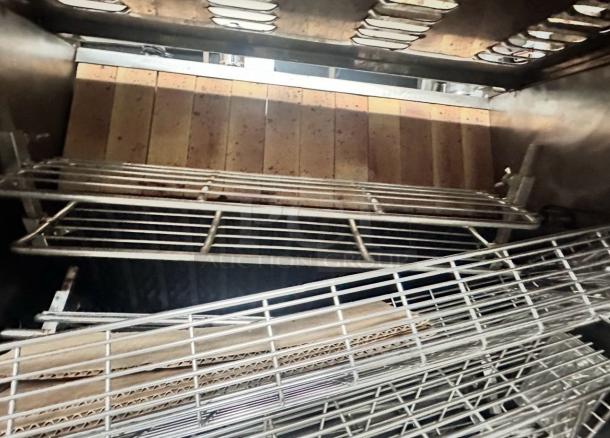 Rotisol 950-2 gas rotisserie oven in excellent condition, featuring multiple shelves and natural gas operation, fully tested.