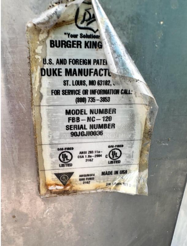 Label on Duke FBB-NC-120 gas conveyor broiler. "Burger King Model," fully tested, excellent condition. Made in USA.