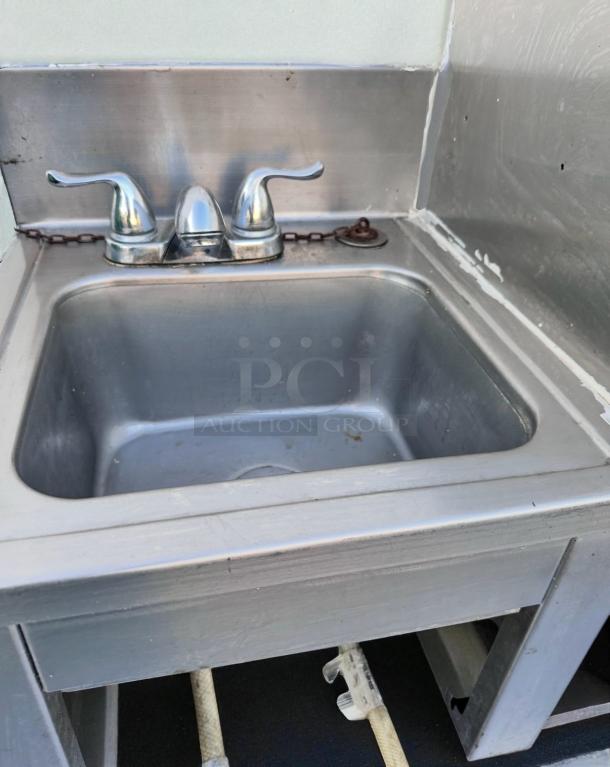 Stainless steel drop-in hand sink with dual-handle faucet, 18.5"x17.5"x18.5". Excellent condition, ready to use.