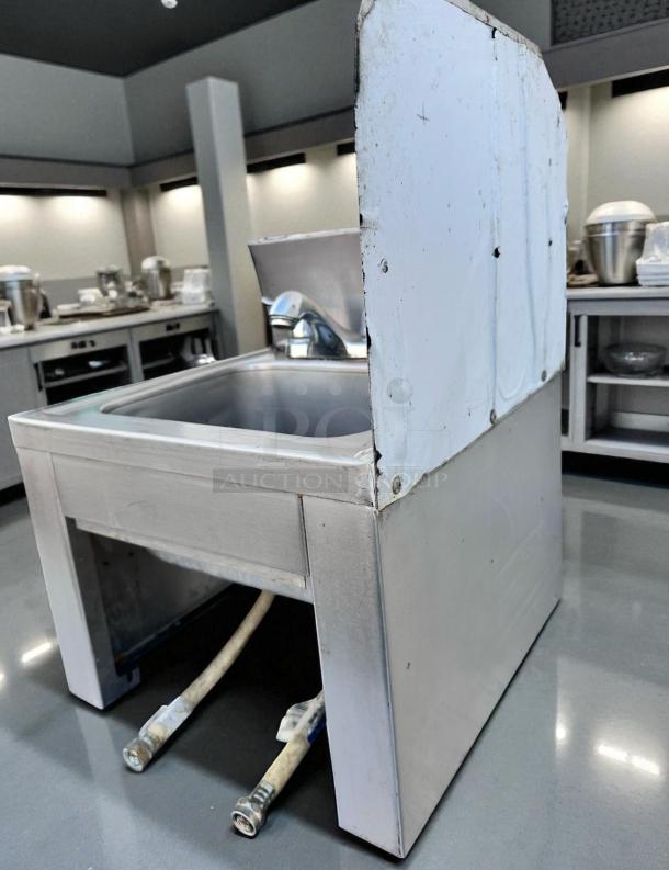 Stainless steel drop-in hand sink with dual-handle faucet, 18.5" x 17.5" x 18.5", excellent condition, ready to use.