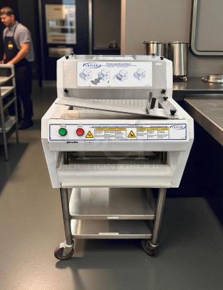 Oliver 702N front load bread slicer in excellent condition, 115V, fully tested and working, features start/stop buttons, safety labels.