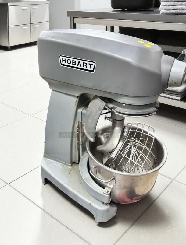 Hobart HL200 20 Qt commercial mixer in excellent condition; fully tested, 100–120V, includes mixing bowl and attachments.
