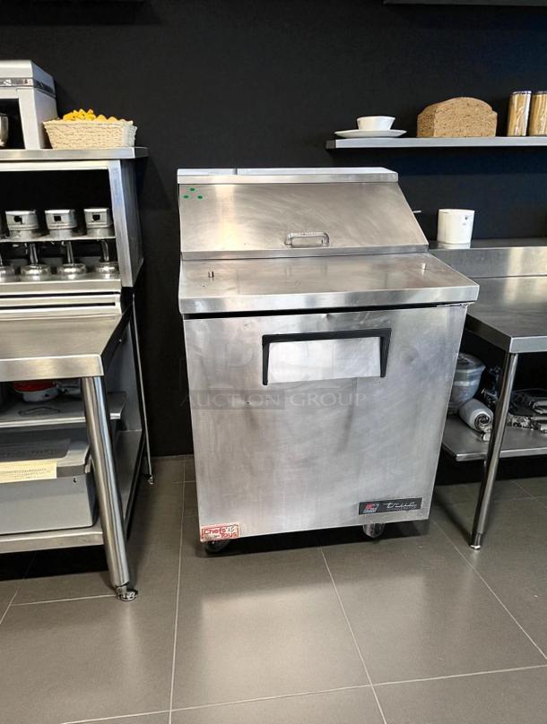 True TSSU-27-08 27" one-door sandwich/salad prep table in excellent condition, stainless steel, tested, branded label shown.