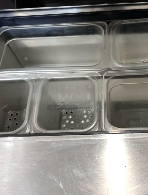 True TSSU-27-08 sandwich prep table with steel pans, excellent condition, fully tested, 27-inch, 115V.