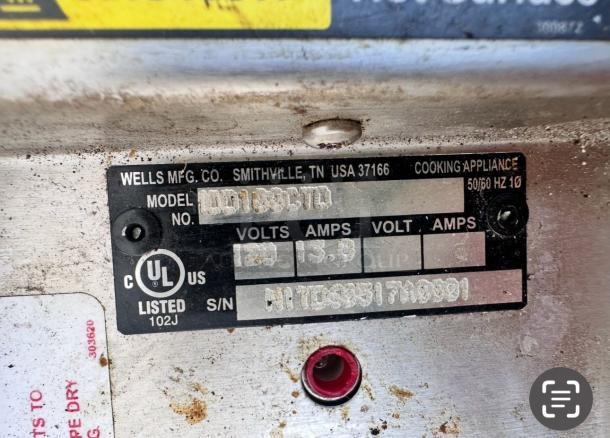 Wells MOD100TDM drop-in food warmer label, showing model, UL listing, voltage 120V, and 13.8 amps. Excellent condition.