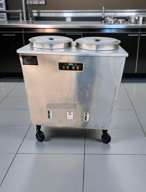 Wellborn BS-65L2 double lid electric soup boiler in excellent condition, 220V, fully tested. Stainless steel, on caster wheels.