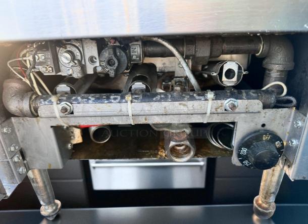 Imperial IFS-25 gas fryer underside, showing gas connections and dial. Stainless steel, 65,000 BTU, excellent condition.