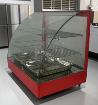 COZOC FW5004-2 countertop food display warmer in excellent condition, 120V, with curved glass front and metal shelves.
