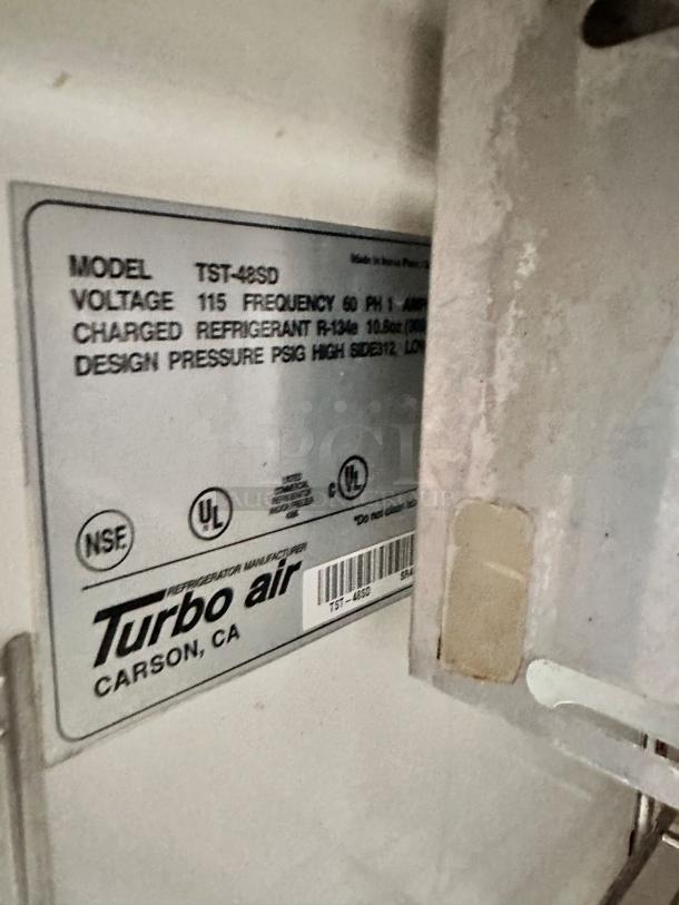 Turbo Air TST-48SD sandwich/salad prep table label, model and voltage details shown; excellent condition.