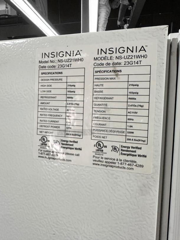 Insignia NS-UZ21WH0 Upright Freezer in excellent condition; 21 Cu. Ft., white. Model and specifications label visible.