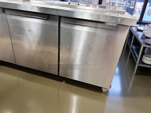 Continental 3-door stainless steel refrigerated worktop prep table, excellent condition, fully tested, on casters.
