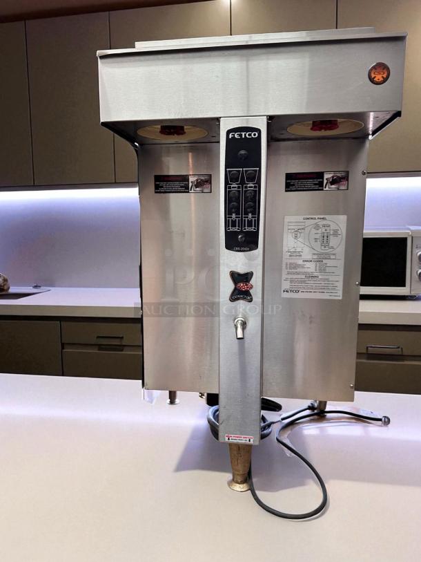 FETCO CBS-2042e twin station commercial coffee brewer, 240V, stainless steel, fully operational, tested, with control panel.
