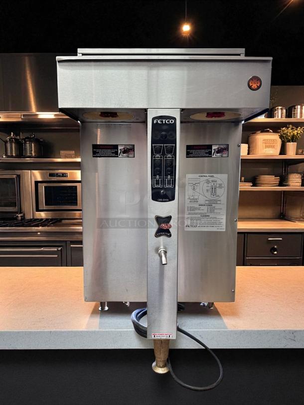 FETCO CBS-2042e twin station commercial coffee brewer, 240V, fully operational, stainless steel finish, control panel visible.