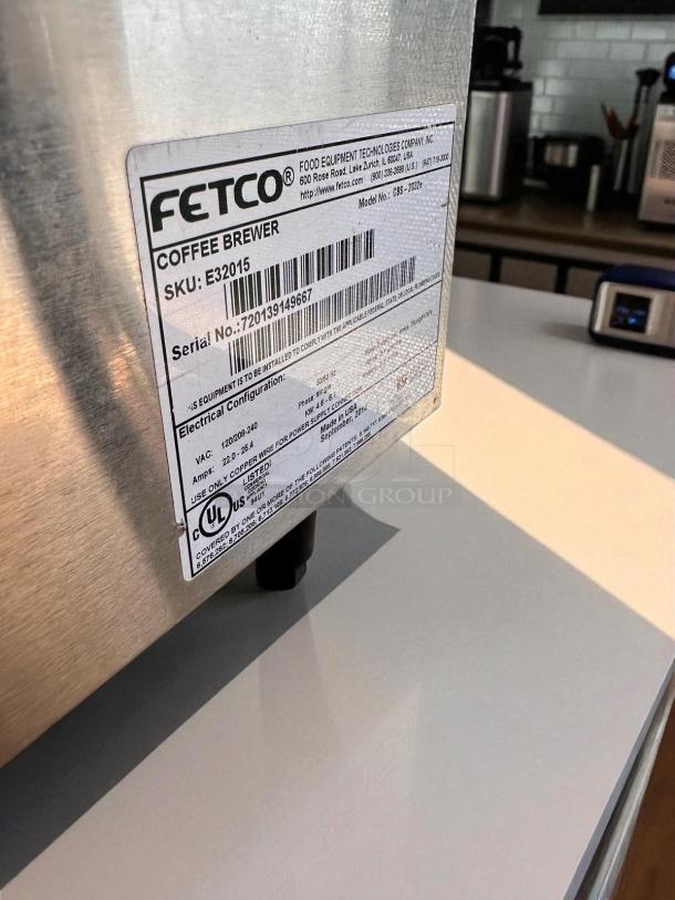 Fetco CBS-2032e dual station coffee brewer in outstanding condition; 220-240V, fully tested, label details visible.